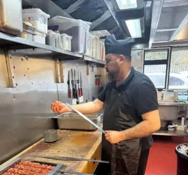 Chef preparing kebabs in the kitchen